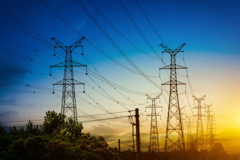 enov.sun-setting-silhouette-electricity-pylons